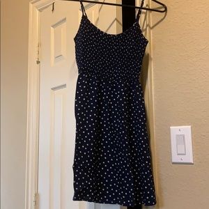 Navy blue dress with white polka dots.